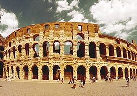 your visit to rome-Colosseum with visitors walking in front